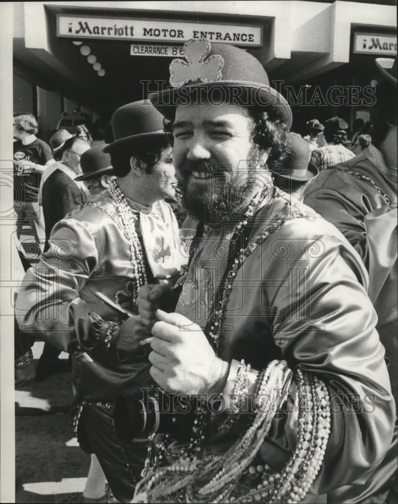 1975 Carnival Masker in Shamrocks Carrying Beads in New Orleans - Historic Images