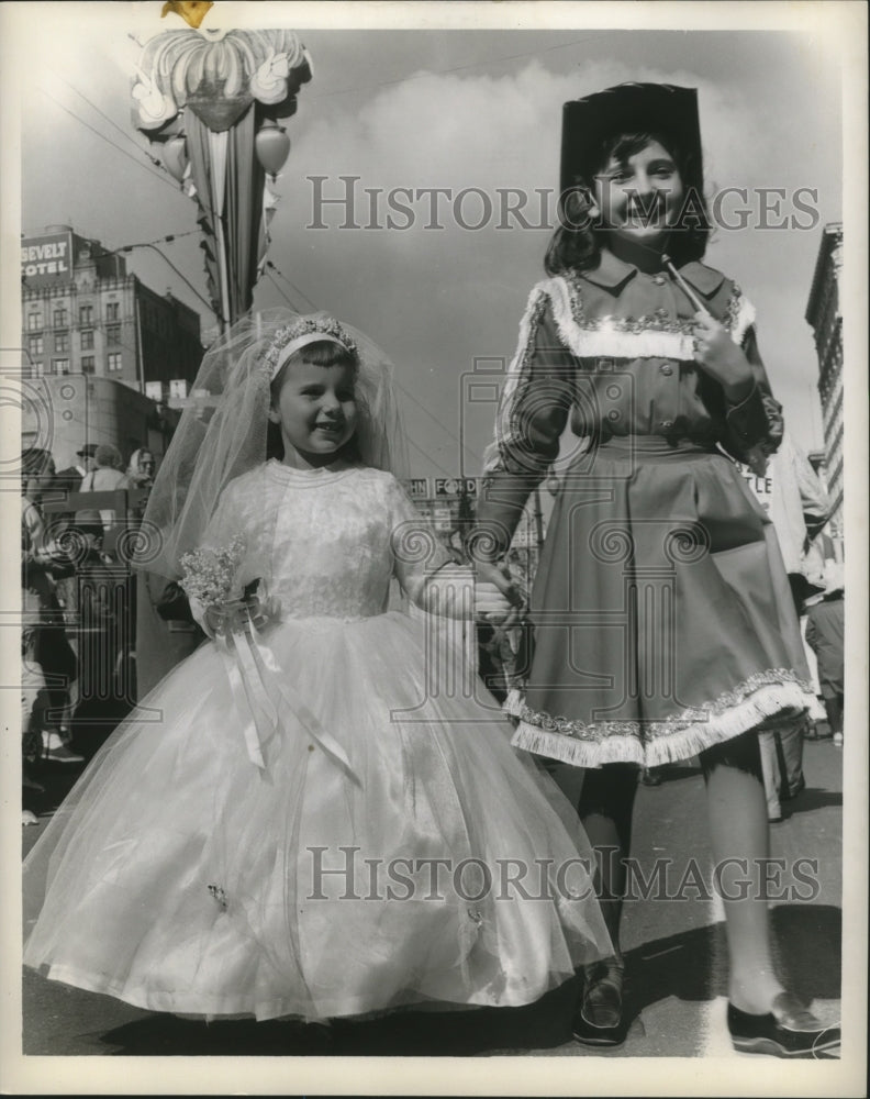 1963 New Orleans Mardi Gras children in bride and cowgirl costume - Historic Images