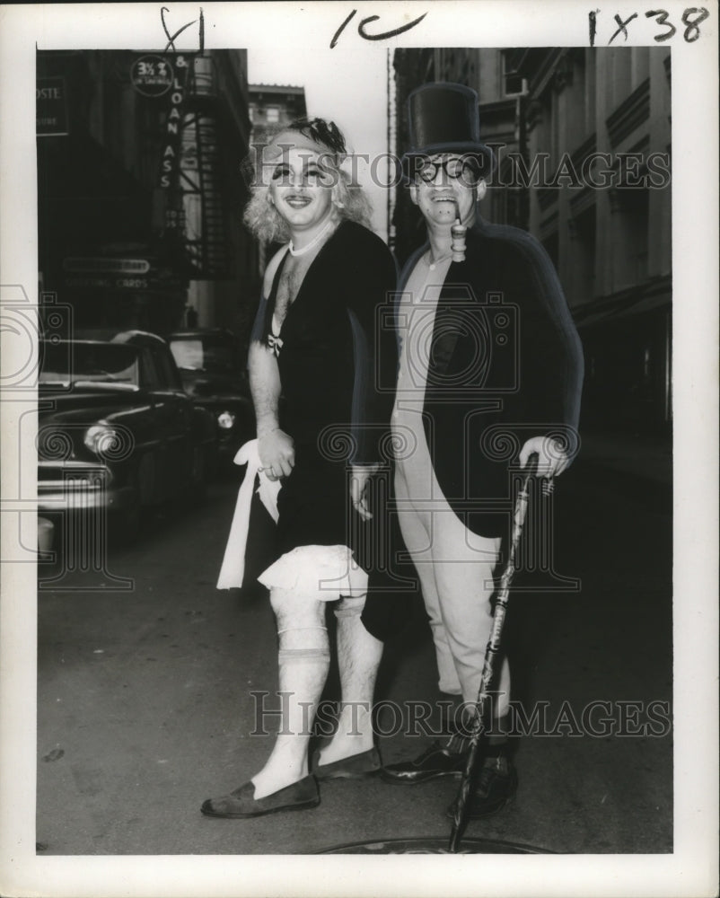 1957 New Orleans Mardi Gras newlyweds costumes in the street - Historic Images