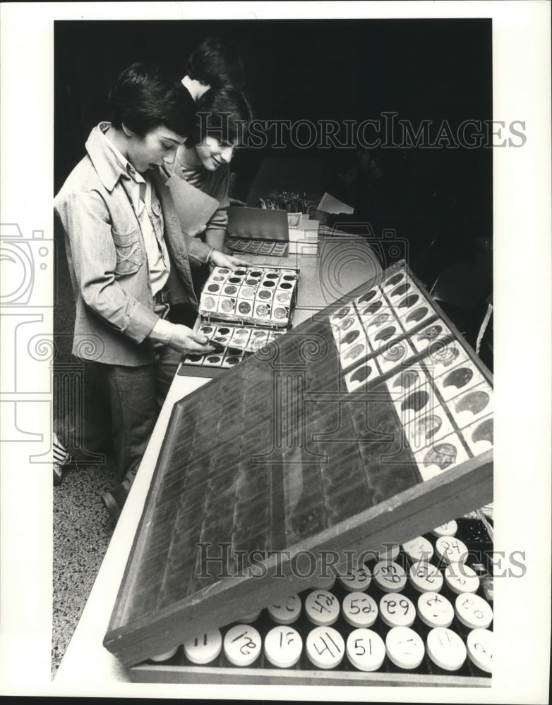 Carnival Revelers looking through catalogues  - Historic Images