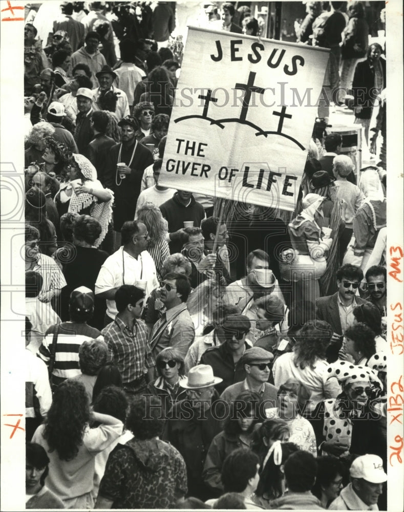 1988 New Orleans Mardi Gras Carnival with religious zealot banner. - Historic Images