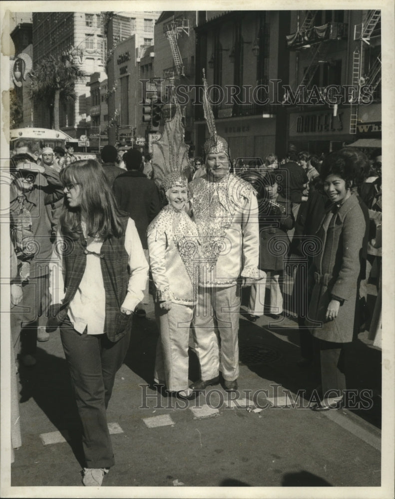 1971 Carnival Maskers stand out in crowd  - Historic Images