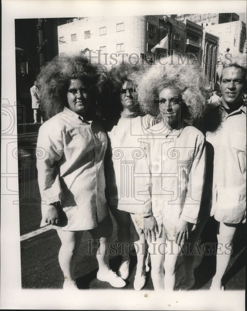 1971 Carnival maskers with a bad hair day.  - Historic Images