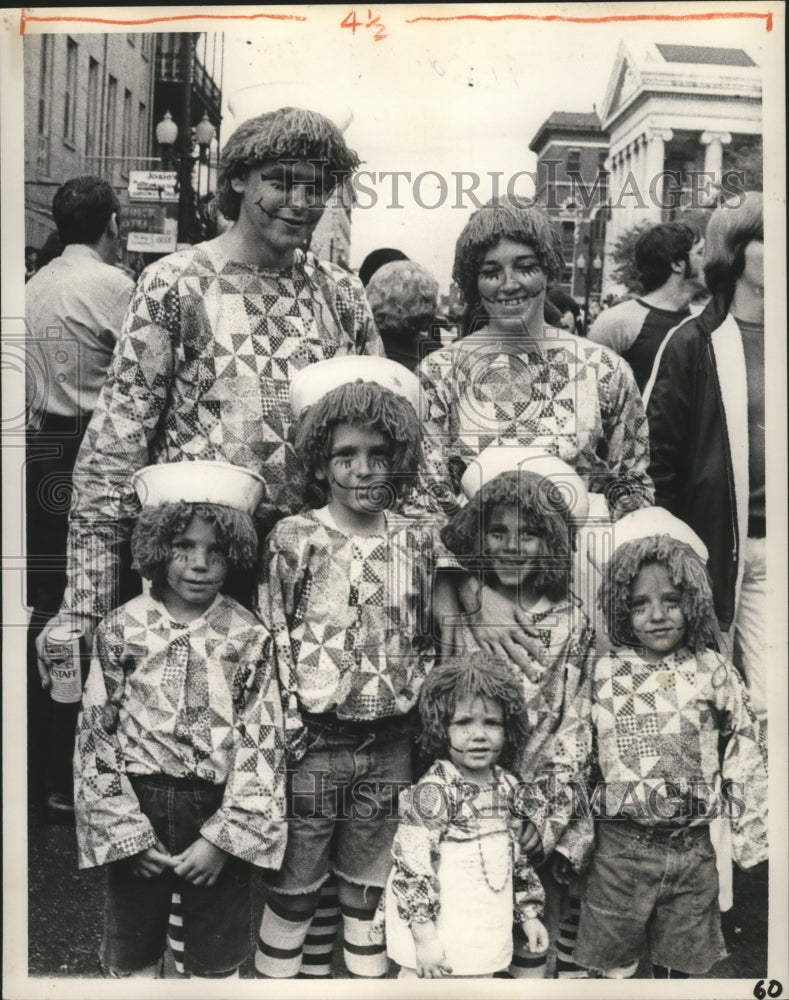 1972 Carnival maskers family of clowns pose for photographer. - Historic Images