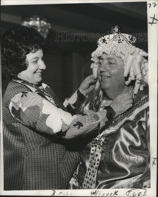 1973 Carnival maskers Dr, Joseph Pugilaa gets last minute adjustment - Historic Images