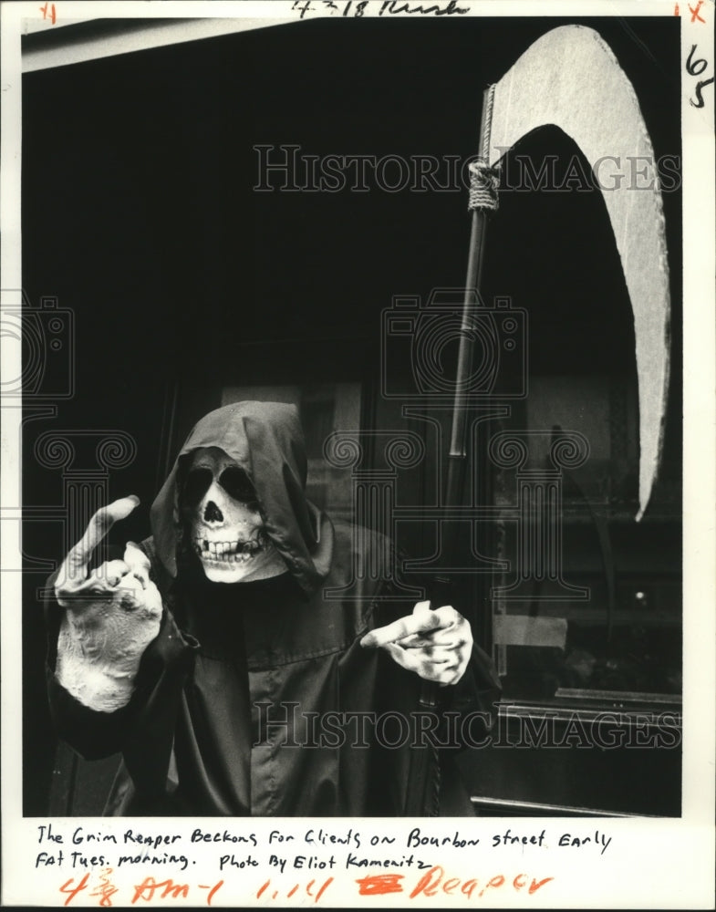 1982 The grim reaper beckons for clients on Bourbon St. Fat Tuesday - Historic Images