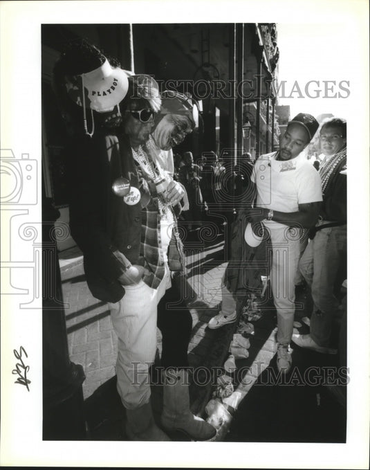1992 Reggie Wilcox looks at Bob Andrew's three headed man costume - Historic Images