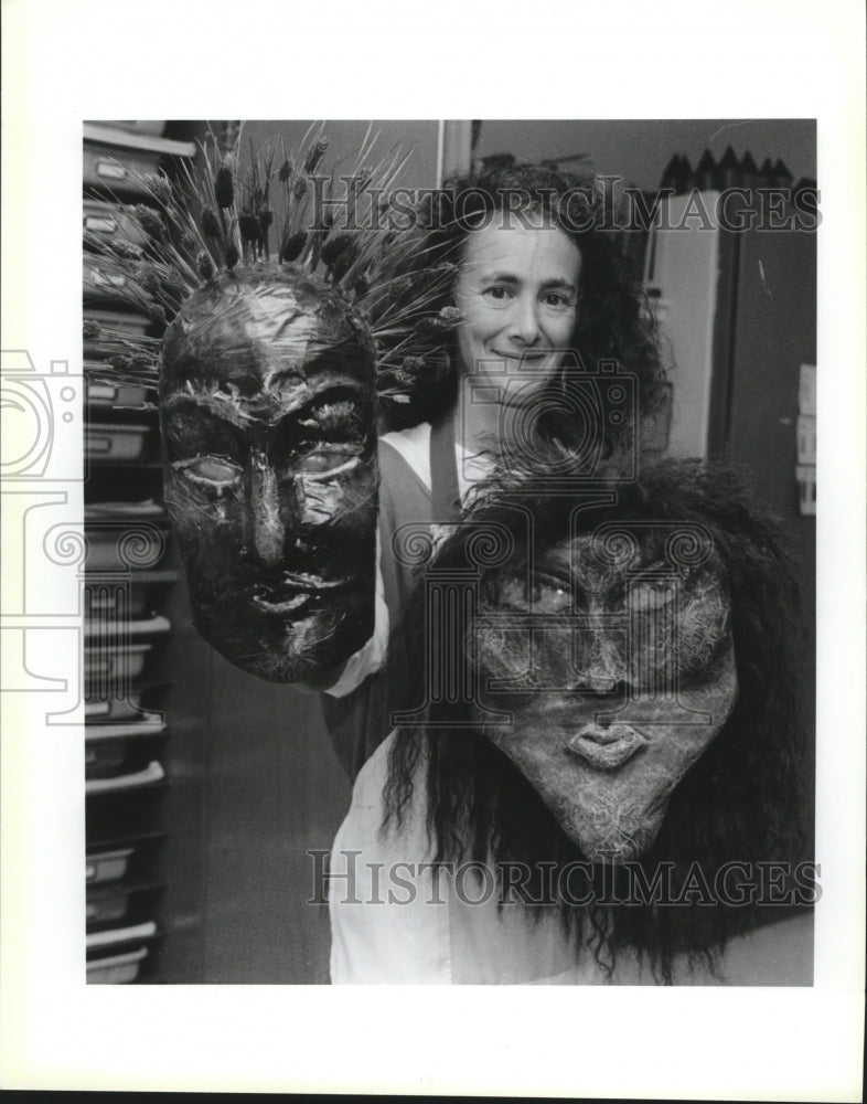 1993 Deb Rosenbohm, teacher at Hannan High school, holds up masks - Historic Images