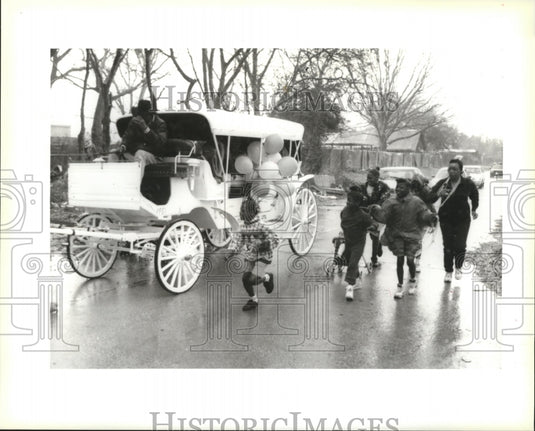 1996 King & Queen of Krewe of MARY Parades In Rain in New Orleans - Historic Images