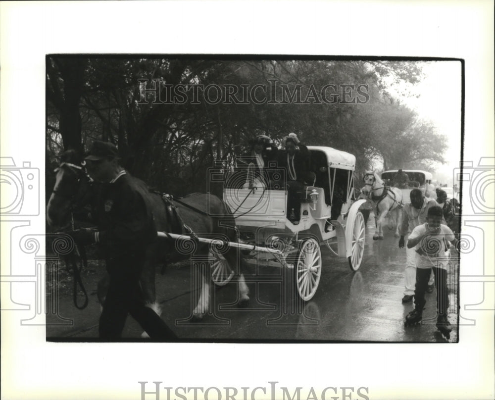 1996 Area kids get rain soaked while their parade is rained on. - Historic Images