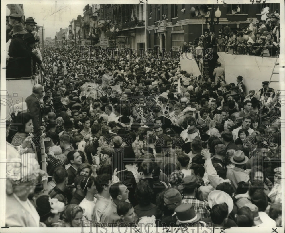 1965 Mardi Gras carnival with traditional joyous crowds.  - Historic Images