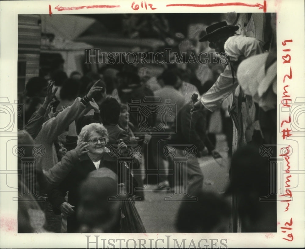 1984 Man on Float Hands Rose to Lady at Carnival in New Orleans - Historic Images