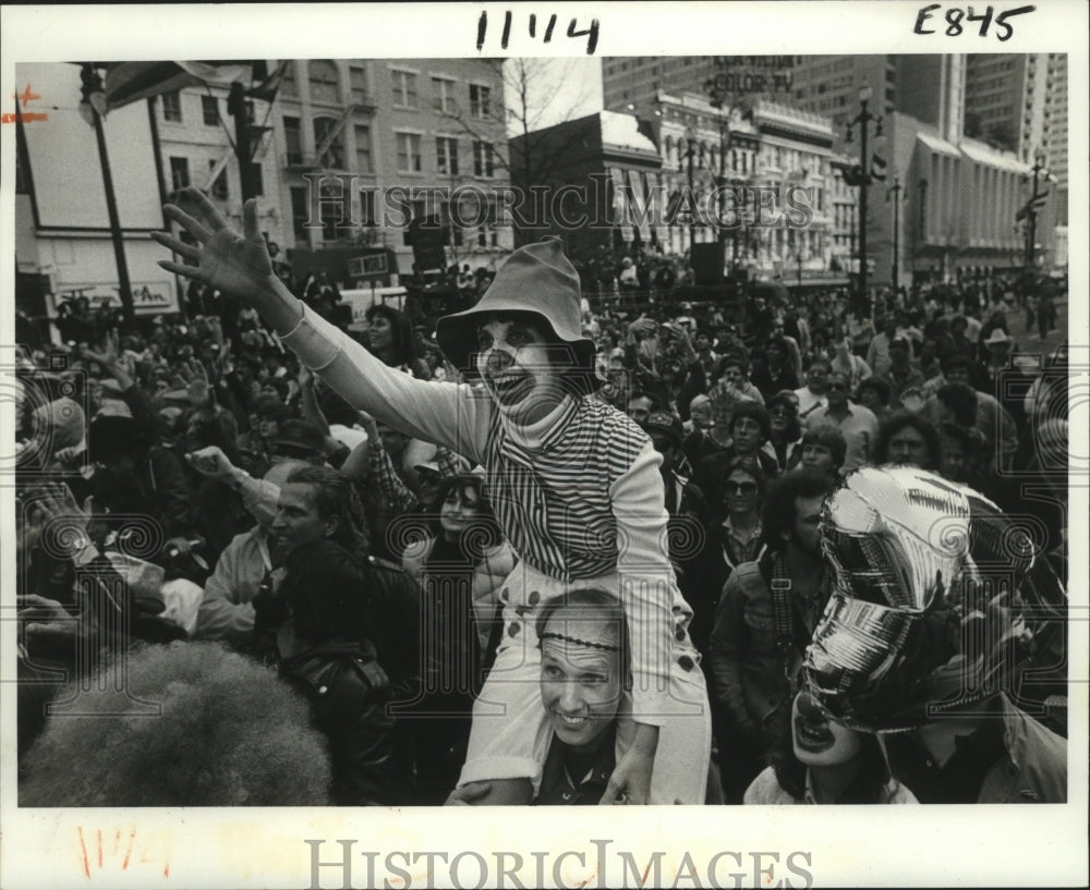 1983 Kathy Genois as Clown Waves for Beads at New Orleans Carnival - Historic Images