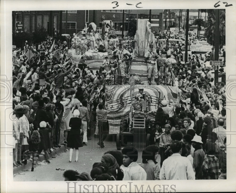 1972 crowds watch the Krewe of Carrollton Parade floats pass by - Historic Images