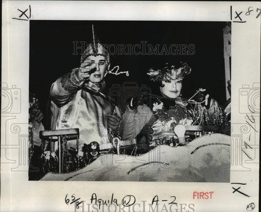 1978 float riders in the Krewe of Aquila's parade throw beads - Historic Images