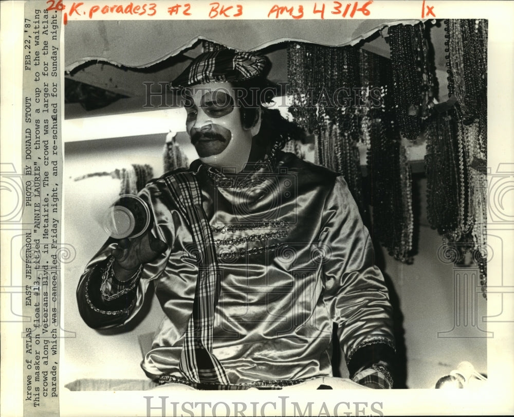 1987 Masker on &quot;Annie Laurie&quot; Float for Krewe of Atlas, Mardi Gras - Historic Images