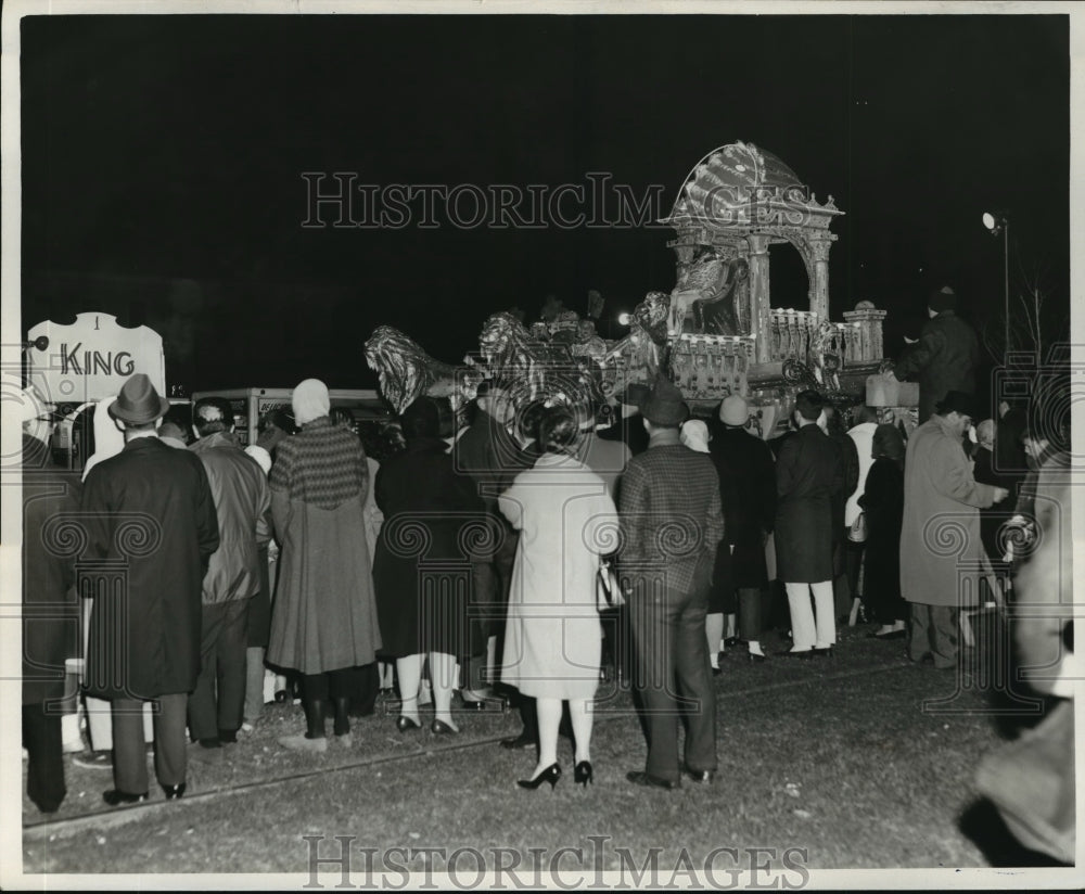 1965 people watch passing Babylon parade floats at Mardi Gras - Historic Images