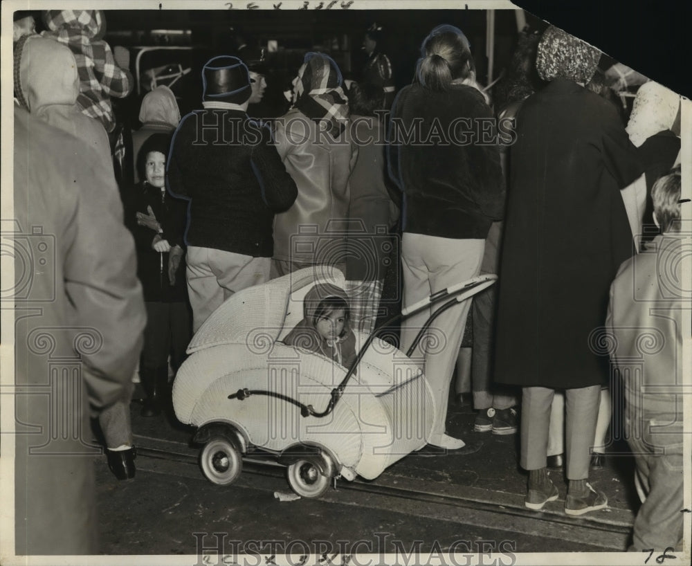 1965 little girl too cold to watch a Mardi Gras parade  - Historic Images