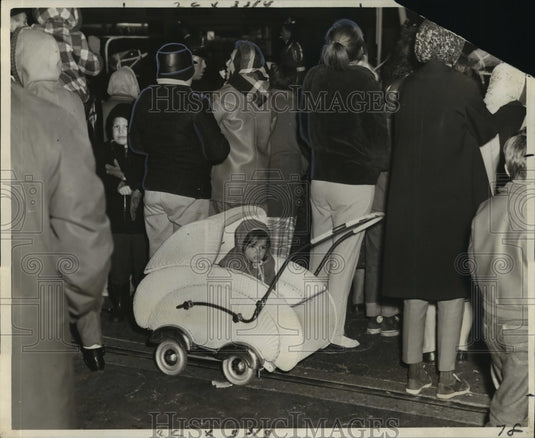 1965 little girl too cold to watch a Mardi Gras parade  - Historic Images