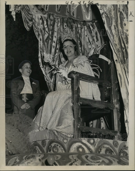 1962 Queen of Adonis wave scepter at head of a Mardi Gras parade - Historic Images