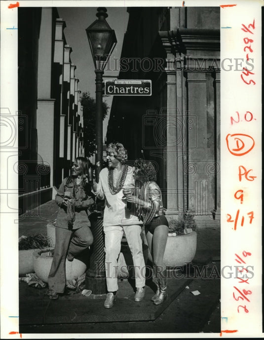 Three People on Chartres Street New Orleans Carrying Carnival Beads - Historic Images