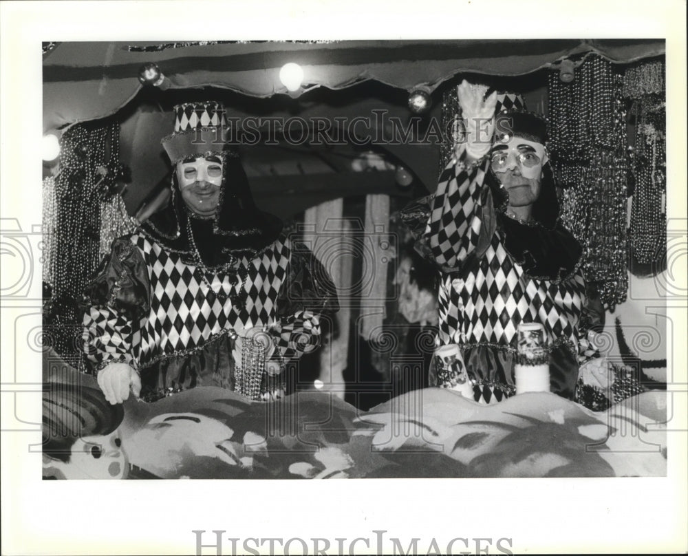 1991 Members of the Krewe of Opheus during their Mardi Gras parade - Historic Images