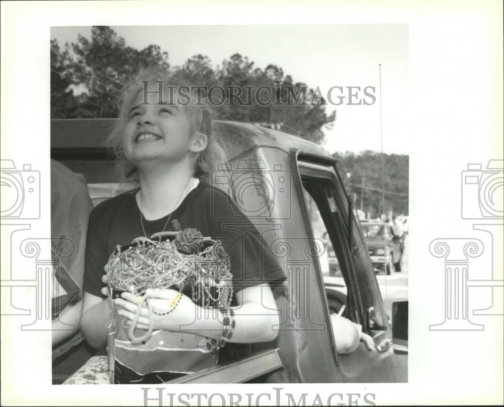 1992 Nikki Anderson Clutches Mardi Gras Treasures Obtained at Parade - Historic Images