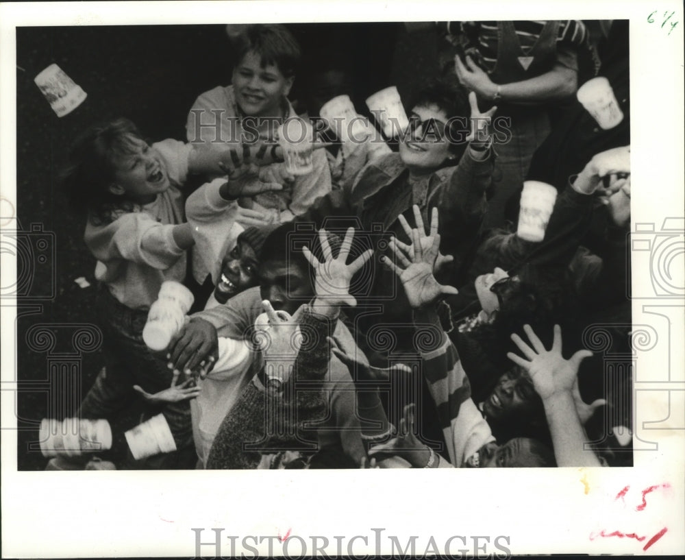 1988 Carnival Parade Crowd Reaching for Cups Thrown from Float - Historic Images