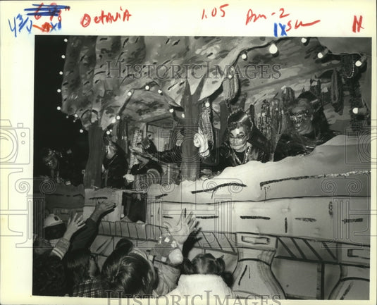 1984 Carnival Parade Hands reach for doubloons from Krewe of Octavia - Historic Images