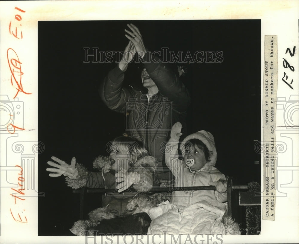 1982 Family Yells and Waves During Krewe of Caesar Parade Rolls Past - Historic Images