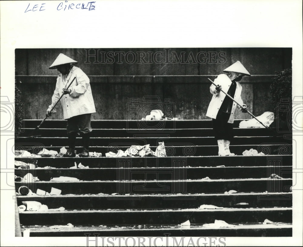 1983 Two Workers Clean Up Trash after Carnival in New Orleans - Historic Images