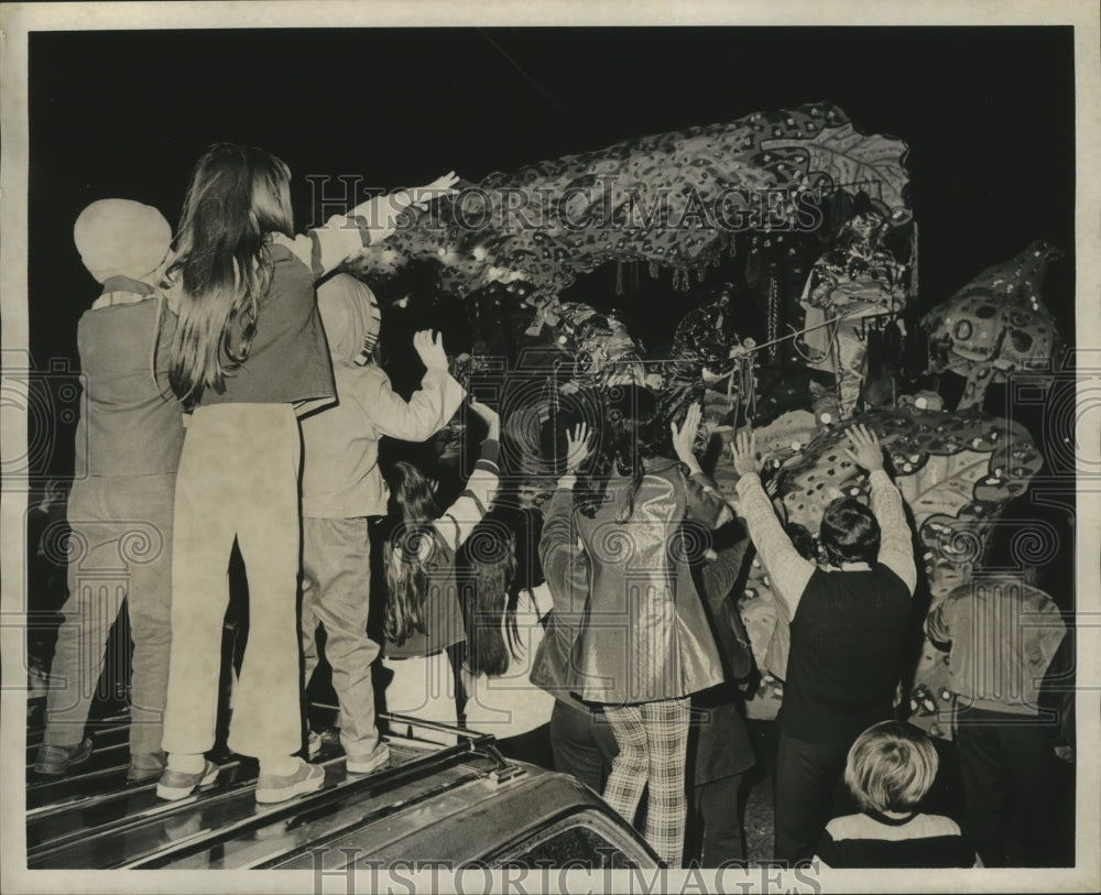 1974 Spectators Reach for Throws from Krewe of Jason Parade Float - Historic Images