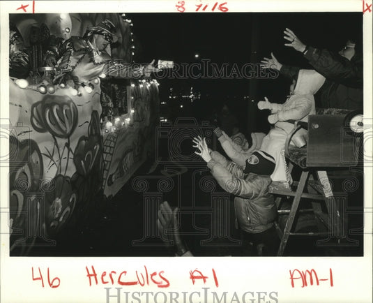 1985 Krewe of Hercules Rider Throwing Cup from Carnival Parade Float - Historic Images