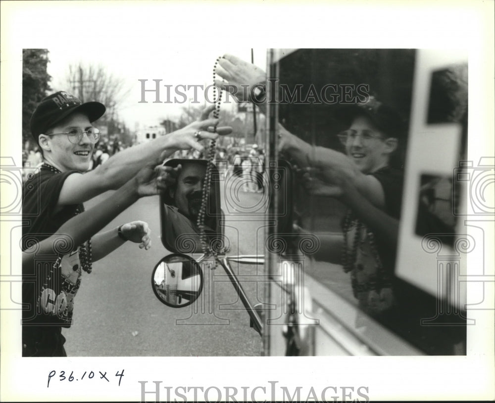 1994 Handing Beads to Crowd at Krewe of Lul at Carnival Parade - Historic Images