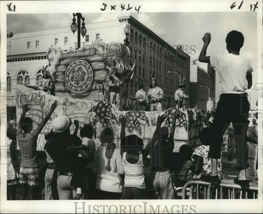 1975 Krewe of Mokana Parade Gets Canal St. Reception at Mardi Gras - Historic Images