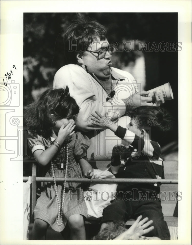 1991 Carnival Parade Richard Robert Rotharmel Jr. brings in a cup. - Historic Images