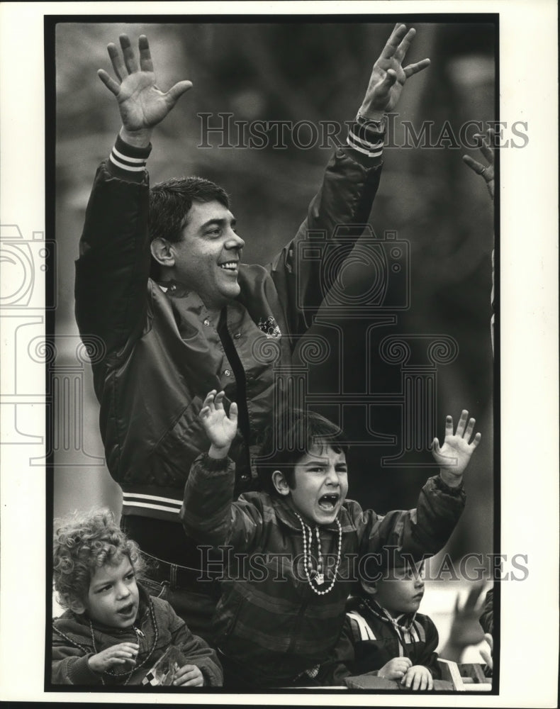 1983 Man &amp; Three Children on Ladder Yells at Krewe of Isis Masker - Historic Images