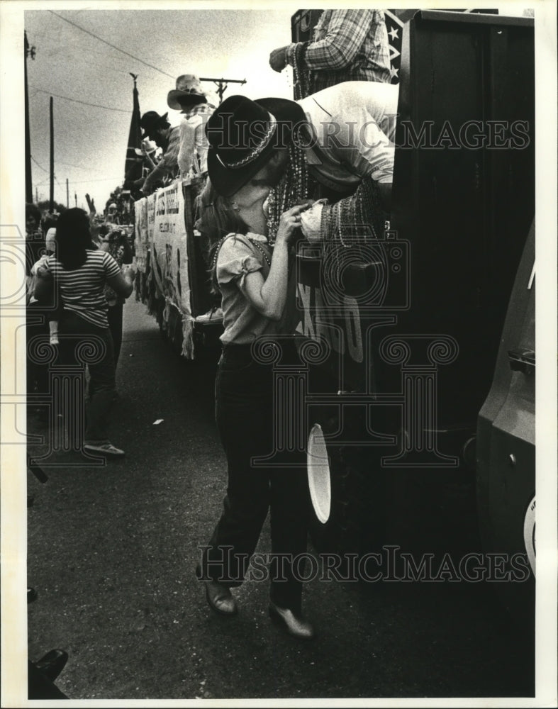 1982 Lady Kisses thrower in Krewe of Grela Parade at Carnival - Historic Images