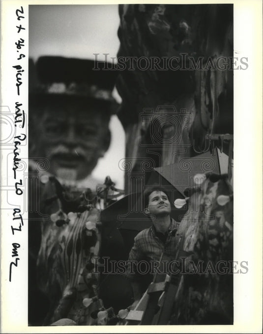 1990 Patrick O'Cain Checks Weather on Krewe of Hercules Parade Float - Historic Images