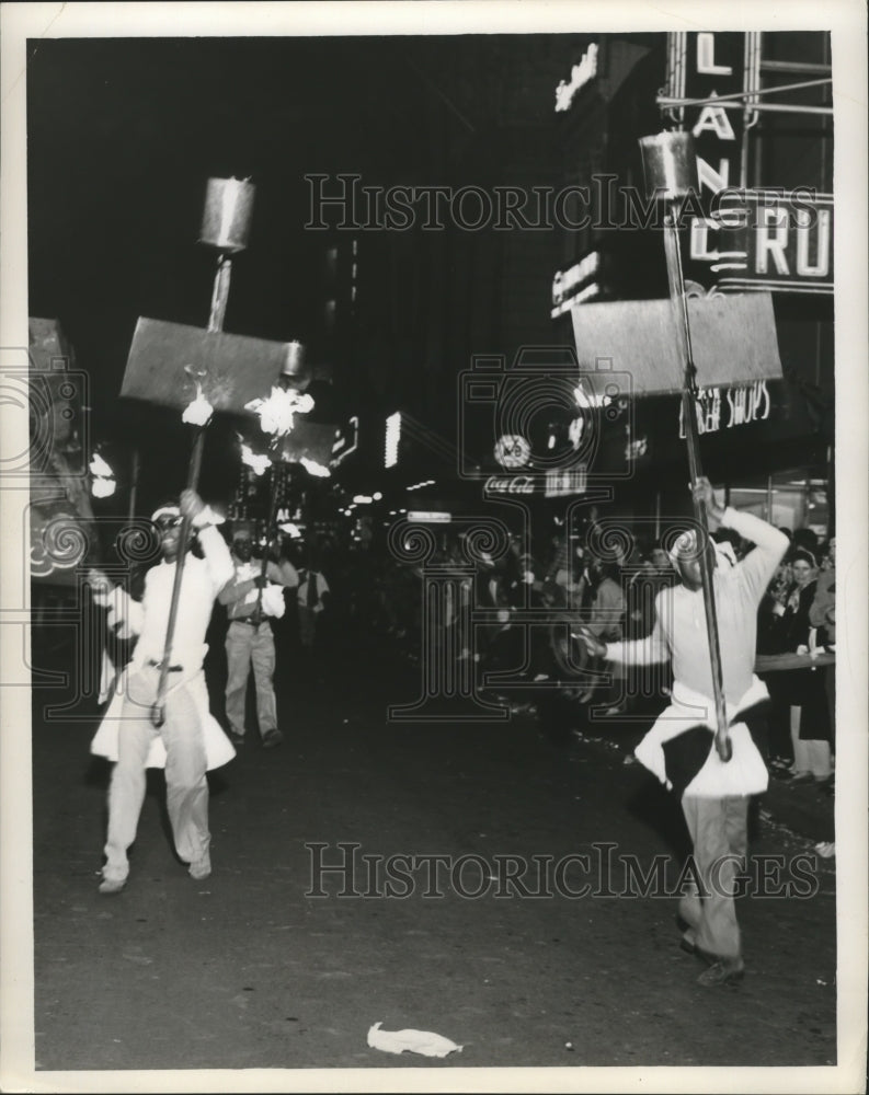 1962 Flambeau Carriers Lighting the Way in Carnival Parade - Historic Images