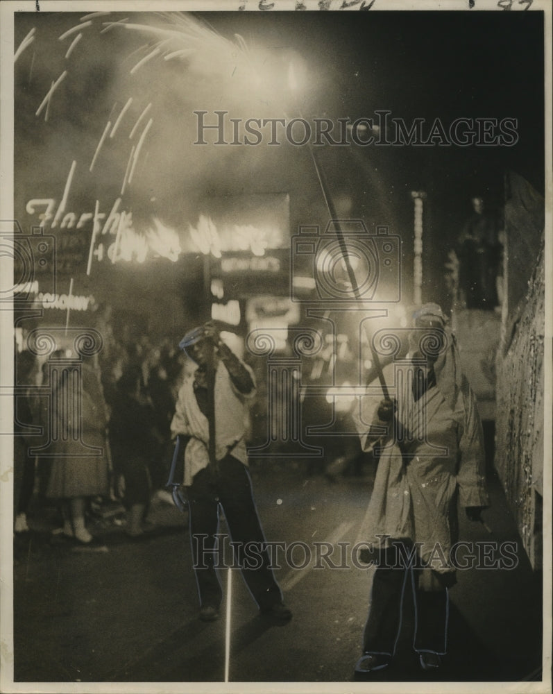 1961 Flambeau Carriers with Colorful Torches in Carnival Parade - Historic Images