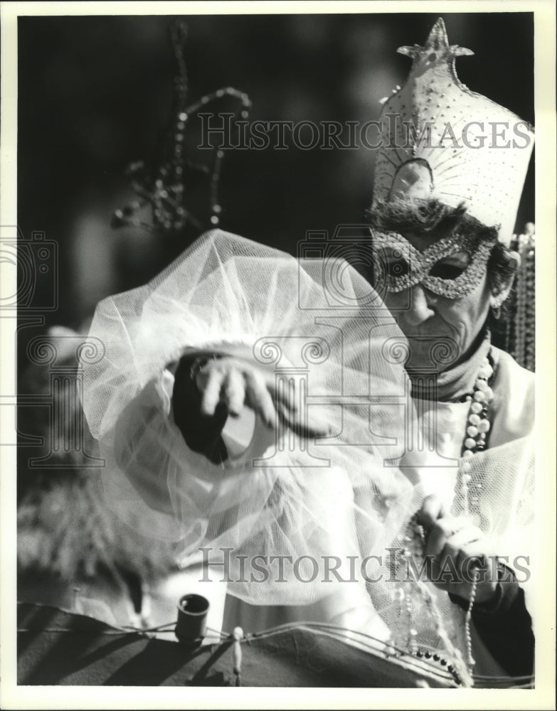 1989 Krewe of Flora Masker Throwing Beads in Carnival Parade - Historic Images