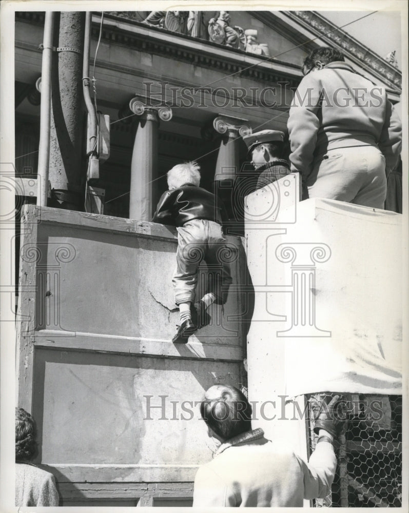 1964 Child Climbing for Better View at Carnival Parade Mardi Gras - Historic Images