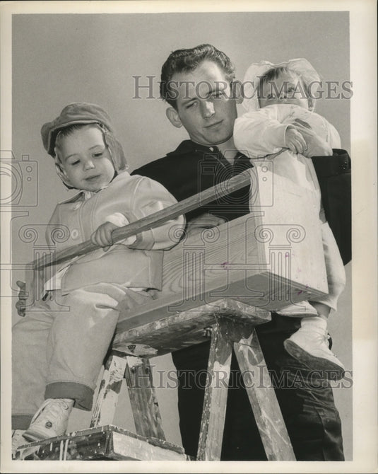 1963 Man with Two Kids on Ladder to View the Carnival Parade - Historic Images