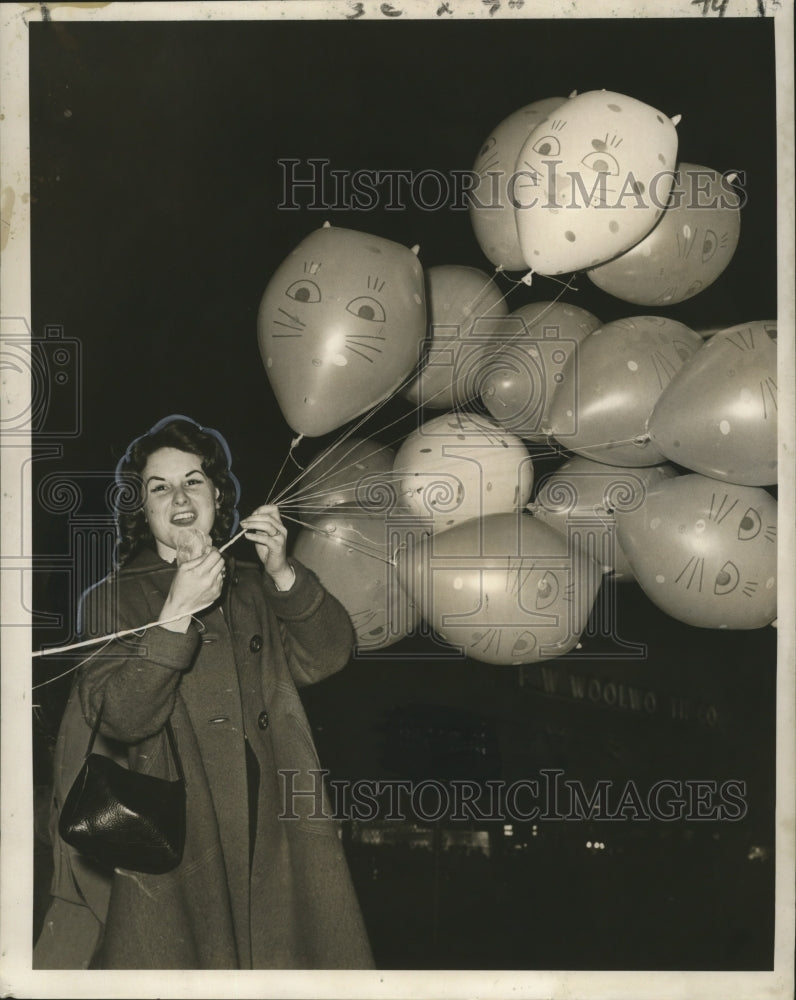 1961 Woman Holding Cluster of Balloons at Carnival Parade Mardi Gras - Historic Images