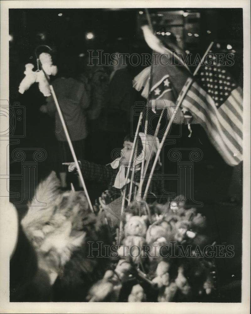 1963 Child Looking at Carnival Vendor&#39;s Items Mardi Gras Orleans - Historic Images