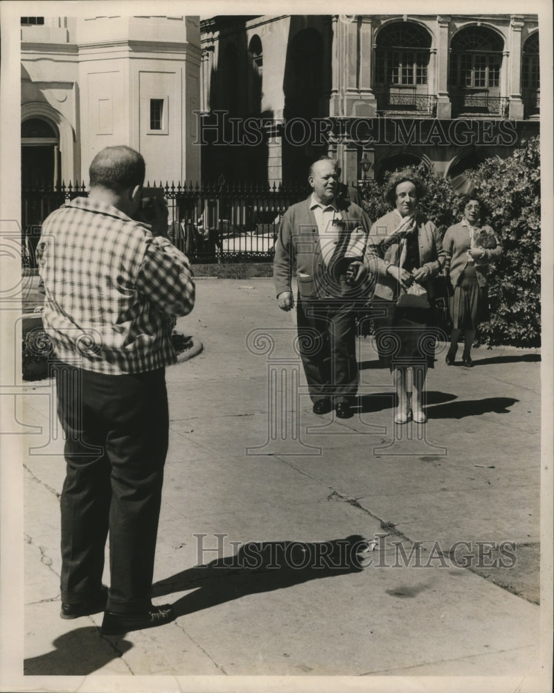 1962 Man Taking Photo of a Carnival Visitors in New Orleans - Historic Images