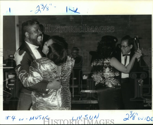 1988 Carnival Ball Revelers dance to strains of The Untouchables - Historic Images