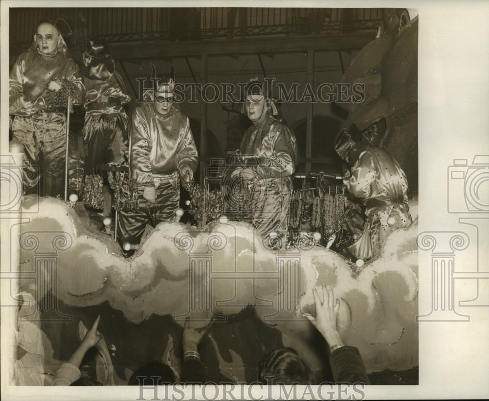 1968 Maskers on Krewe of Pegasus Float in Parade at Mardi Gras - Historic Images