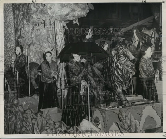 1955 Carnival Parade Maskers on float in Orion's Parade. - Historic Images